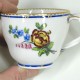 Tasse dite gobelet "Hébert" et sa soucoupe à décor polychrome - XVIIIe siècle