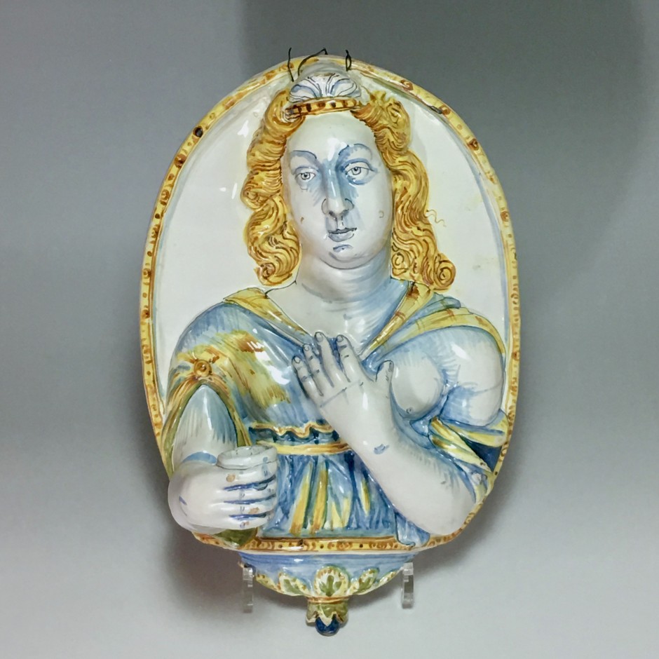 Nevers earthenware of the seventeenth century - plate forming an arm holding a candle