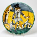 Montelupo - Majolica dish decorated with a man holding a stick in his hand - Seventeenth century - SOLD